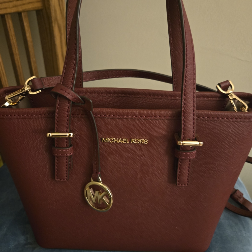 Michael Kors Maroon Handbag with Gold Accents And Matching Phone Holding Wallet